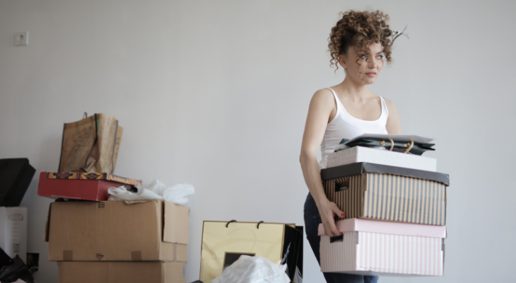 Woman carrying clutter